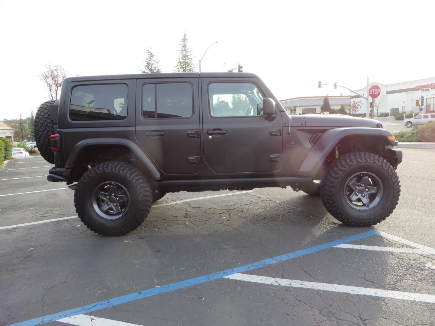 2020 BLACK /BLACK Jeep Wrangler Unlimited Rubicon (1C4HJXFGXLW) with an 3.6L V6 DOHC 24V FFV engine, 6A transmission, located at 2630 Grass Valley Highway, Auburn, CA, 95603, (530) 508-5100, 38.937893, -121.095482 - STANDARD CONTENT AEV RX Front Bumper AEV Front Skid Plate AEV Non-Winch Cover Plate AEV 7000 Series Lights AEV Light Cover Kit AEV 2.5" DualSport RT Suspension System AEV Front Geometry Correction Brackets AEV Steering Stabilizer AEV Rear Bumper AEV Swing-Out Tire Carrier AEV CHMSL Mount - Photo#3